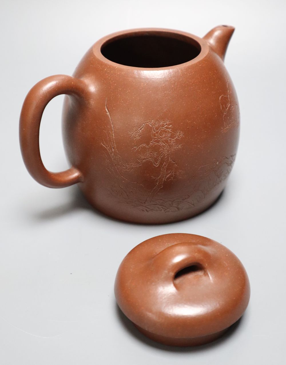 A Japanese Ko Satsuma Chawan, 18th century, a Newhall tea bowl and saucer and a Yixing style redware teapot,